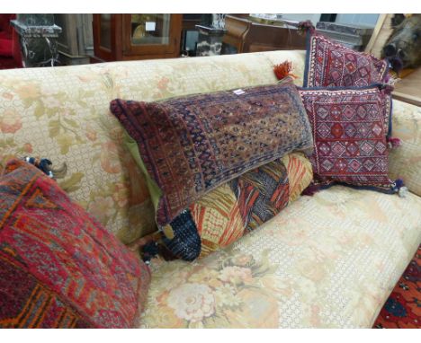 Five various carpet cushions and two rali upholstered pouffe