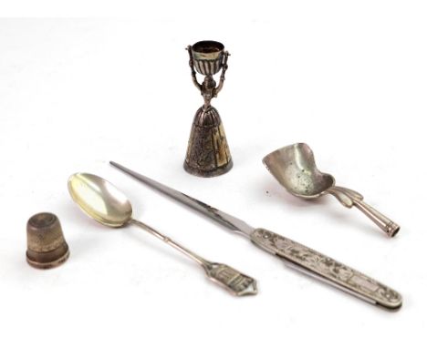 A Dutch silver caddy spoon, 1917, with shovel bowl, 7.5cm long, lacks handle, a thimble detailed sterling silver, a miniature