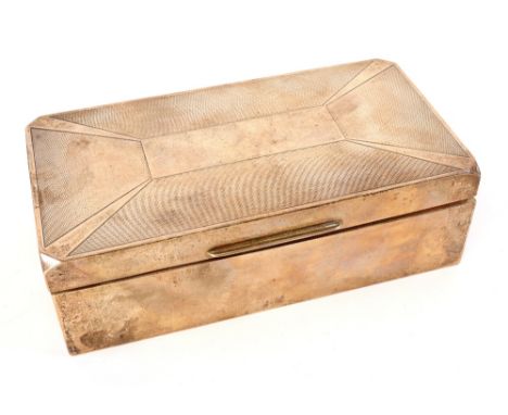 An Art Deco rectangular silver cigarette box, W T Toghill & Co, Birmingham 1934, with hinged engine turned cover, 16.5cm wide