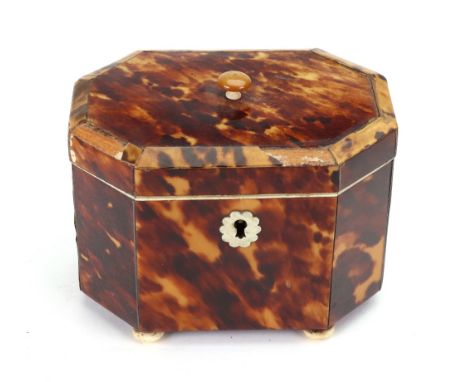 A small Regency tortoiseshell pewter strung octagonal tea caddy, with hinged cover, banded in ivory, on ivory bun feet, 11.5 