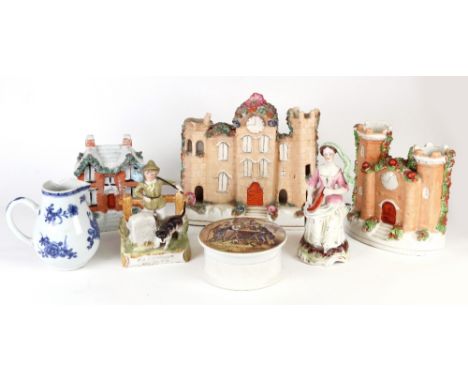 Two Victorian Staffordshire frit decorated castle spill holders, each with a clock face, 20cm & 13cm wide, a later model of a