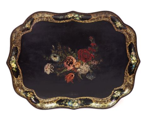 A Victorian Scottish black papier mache tray, stamped R Gray & Son, Glasgow, of serpentine outline, painted with bouquets of 