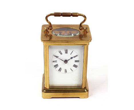 A brass cased carriage timepiece, early 20th century, the white enamel dial with Roman numerals, 14cm high, with key (2).