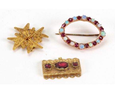 A Victorian gold and garnet necklace clasp, set with three oval mixed-cut stones, 4.6g gross, a gold cannetille Maltese cross