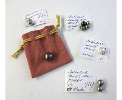 A collection of South Sea cultured pearls, including a near-black 14.3mm round example with minor surface blemishes; another 