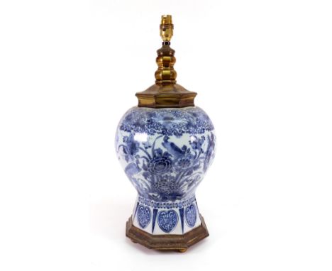 A Dutch Delft blue and white vase, circa 1700, of octagonal baluster form, painted in the Chinese style with birds amongst fl