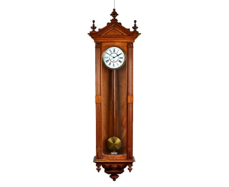 A Vienna style walnut cased wall timepiece, late 19th century, of large proportions, the architectural style case with arched