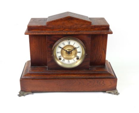 Ansonia Clock Co: an American oak cased mantel clock, late 19th century, in architectural style case, 40cm wide.
