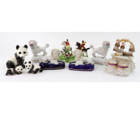 A pair of French porcelain figures of seated King Charles Spaniels, 9cm wide, a pair of Samson porcelain figures of Poodles w