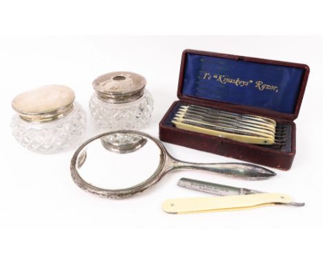 A circular silver mounted diamond cut glass dressing table jar, London 1932, and matching hair tidy, with engine-turned pull-