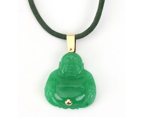 A carved green jade Buddha pendant, in seated position with a yellow metal belly button, mount and suspension loop, unmarked,