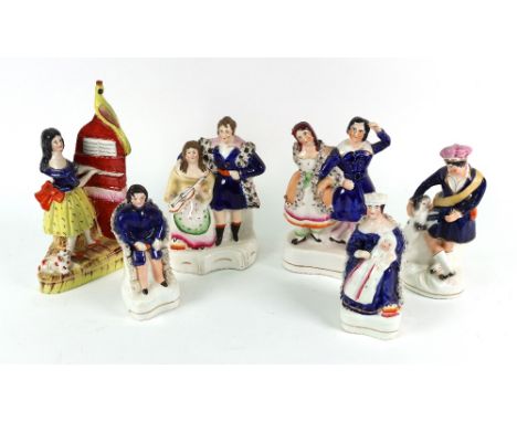 A collection of Victorian Staffordshire, Queen Victoria and Prince Albert seated, 14cm high, two young figures one playing a 