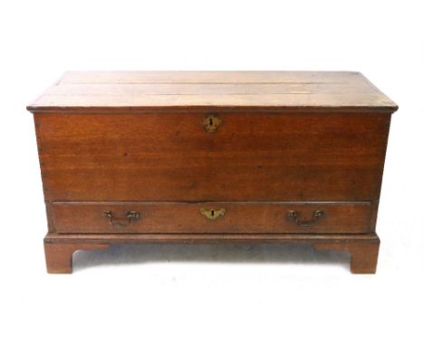 A mid 18th century oak mule chest, with moulded hinged top, drawer below, on later bracket feet, 108cm wide.