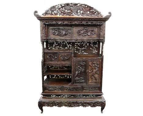 A Japanese carved rosewood Shodana (shelf cabinet), Meiji period, carved and pierced with birds, flowering peony and chrysant