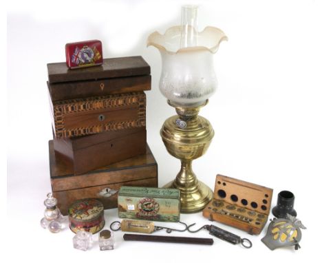 A late Victorian brass oil lamp, with spreading circular base and frosted glass shade, 49cm high, a Victorian walnut and ebon
