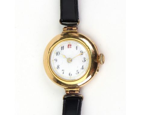 A lady's 18ct yellow gold manual wind wristwatch, circa 1911, the 18mm circular white enamel dial with Arabic numerals and re
