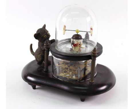 A reproduction automaton timepiece, a gilt metal figure of a standing cat gazing at a glass dome in which three fish move abo