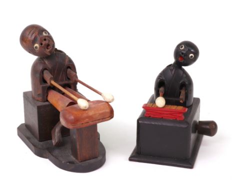 Two carved wooden Japanese Kobi toys, both playing percussion instruments, both arms and heads move when handle is turned, on