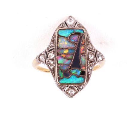 In the manner of Archibald Knox; a gold, diamond and opal shell panel ring, late 19th century, the rectangular opal panel des