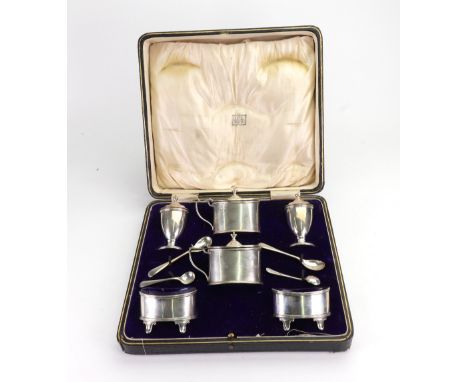 A cased George III style silver double cruet set, Edward John Haseler & C B, Chester 1921 & 1922, of oval and classical vase 