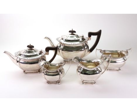 A Regency style silver three piece tea service and matching two piece bachelor service, John Round, Sheffield 1905, 1908 & 19