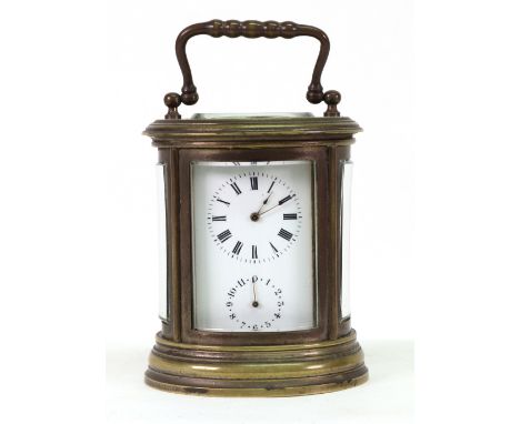 A French miniature oval brass cased carriage clock with alarm, Stamped 'A.D', with lever platform escapement, Roman and Arabi