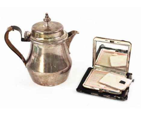 An Art Deco silver hot milk pot, makers C & R C., London 1925, in late 17th century style, bulbous, with scroll handle, 12cm 