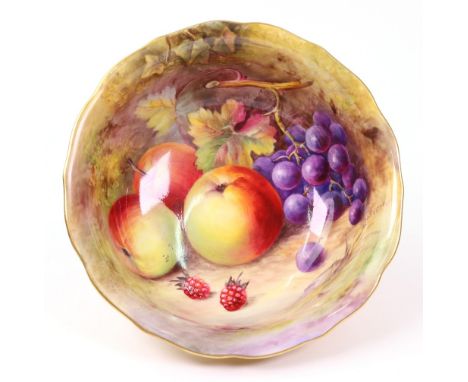 A Royal Worcester shaped circular bowl, painted with fruit by T Lockyer, 20cm diameter.