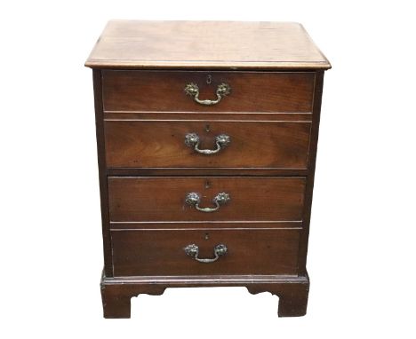 A George III mahogany commode, the moulded rectangular top above a hinged fall front disguised as two drawers, the pull-out s