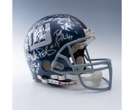 This is an authentic Riddell helmet featuring the team logo on the side and a red stripe down the middle. It was most likely 