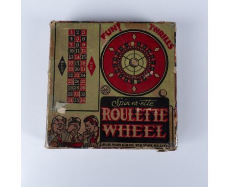 A fun miniature vintage toy of a Roulette wheel with original roulette pill and fold-out gaming table. The set comes in an or