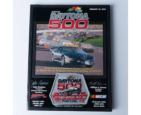 This program from the 1996 Daytona 500 race comes with an attached patch and has a Dale Jarrett signature on the cover.Issued