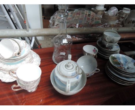 A selection of teaware including Japanese eggshell and a 19th century wine decanter having etched grape decoration