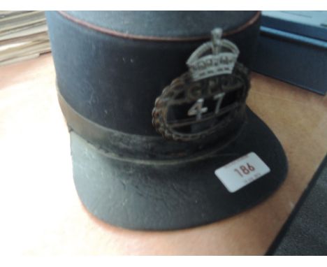 A vintage British postmans hat bearing GPO badge 