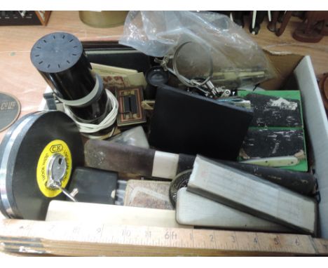 A box of miscellaneous including slide rules and 6ft vintage rule  