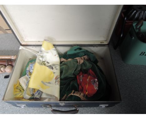 A vintage travel case including linen