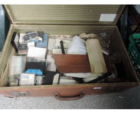 A vintage travel case and contents including cassettes