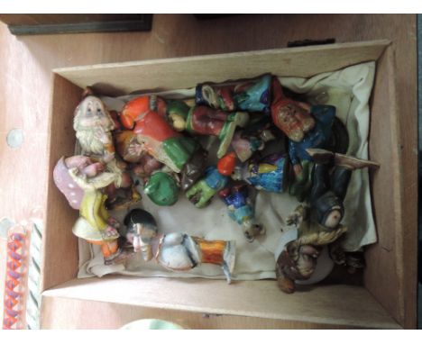 A box of miniature ceramic gnomes 