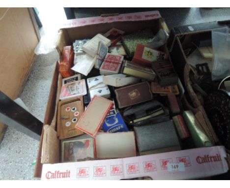 A box of playing cards etc