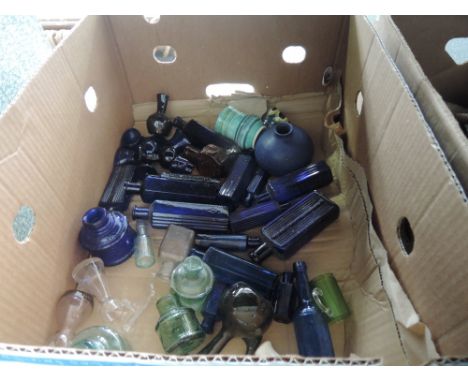 A box of glass ware including vintage coloured bottles etc