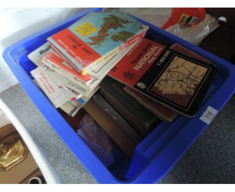 A box of vintage travel guides and maps