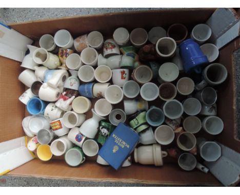 A box of egg cups including Royal Worcester