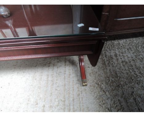 A reproduction mahogany effect sofa style coffee table