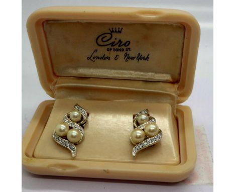 White metal clip on earrings set with pearl and cubic zirconia, in a bakelite case by Ciro of Bond Street, H: 25 mm. UK P&amp