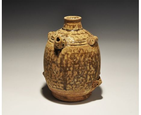 An undated archaistic barrel-shaped ceramic jar with short spout and lateral loops, olive glaze. 511 grams, 15cm (6"). Proper