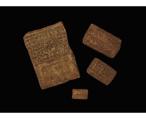 A mixed group of archaistic ceramic tablet copies comprising: one large with lines of cuneiform text to the two broad faces, 