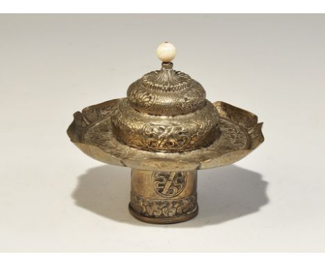 19th century AD. A fabricated tube with running scroll pattern and roundels, octofoil tray with raised rim and repoussé folia