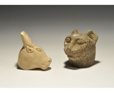 20th century AD. A mixed pair of heads of deities comprising: a composition head of Bastet in feline form; a ceramic head of 