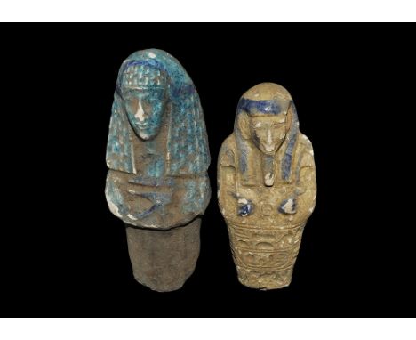 20th century AD. A mixed pair of glazed composition shabtis comprising: one blue with hatched headdress, wedjat symbol to the