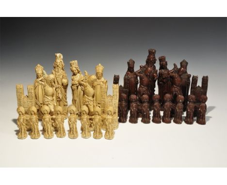 20th century AD. A complete set of medieval-themed ceramic chessmen in ivory and chestnut colours, each with a baize pad to t